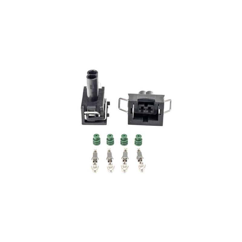 Injector Dynamics EV1 female connector kit with two black housings, green seals, and metal terminal pins.