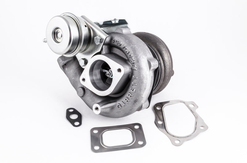 Garrett GT2560R turbocharger, front angle view with wastegate actuator and mounting gaskets shown