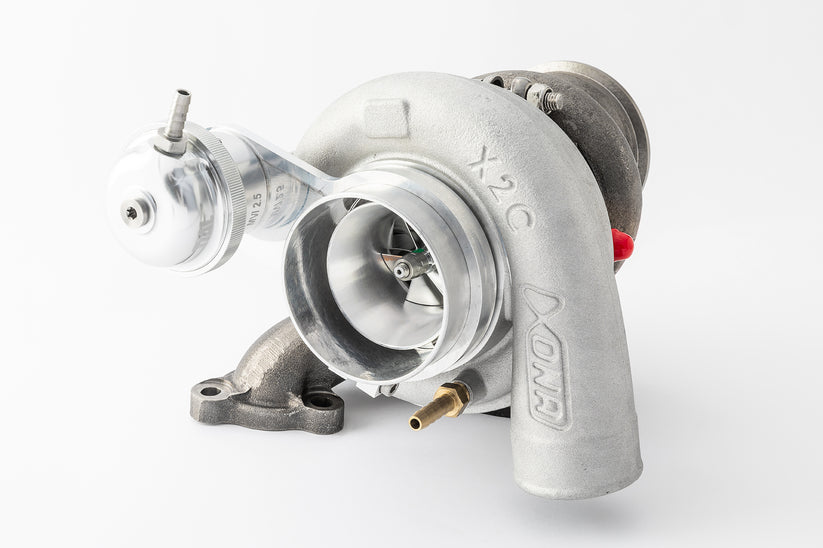 Xona CAN-AM X3 XR4351S X2C turbocharger, angled view showing compressor wheel, wastegate actuator, and X2C housing marking