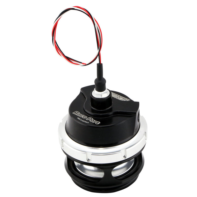 TurboSmart Raceport Gen V HE Sensor Cap in black, shown at an angle with wiring harness and clamp visible.