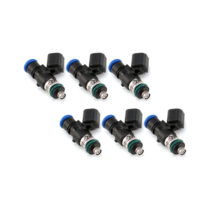 Set of six Injector Dynamics 2600-XDS fuel injectors, angled view showing blue connectors and o-rings.