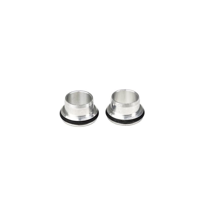 Two Injector Dynamics bottom adapters with black O-rings, silver metal, top angle view