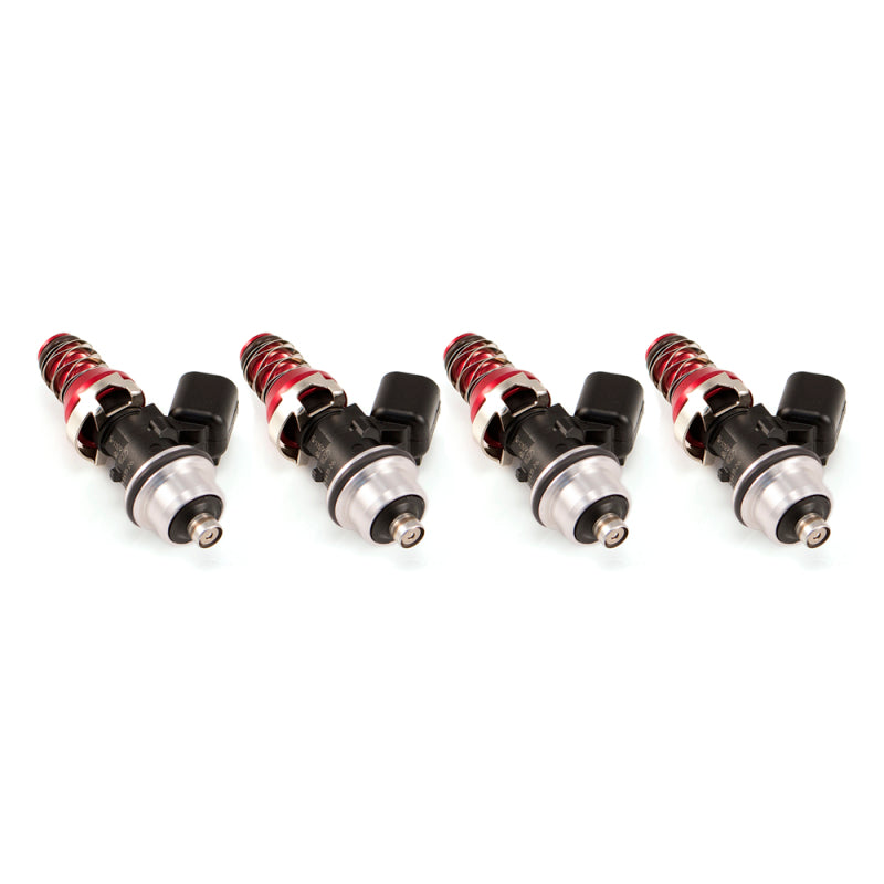 Set of four Injector Dynamics 1340cc fuel injectors, angled view showing red tops, black connectors, and lower o-rings.