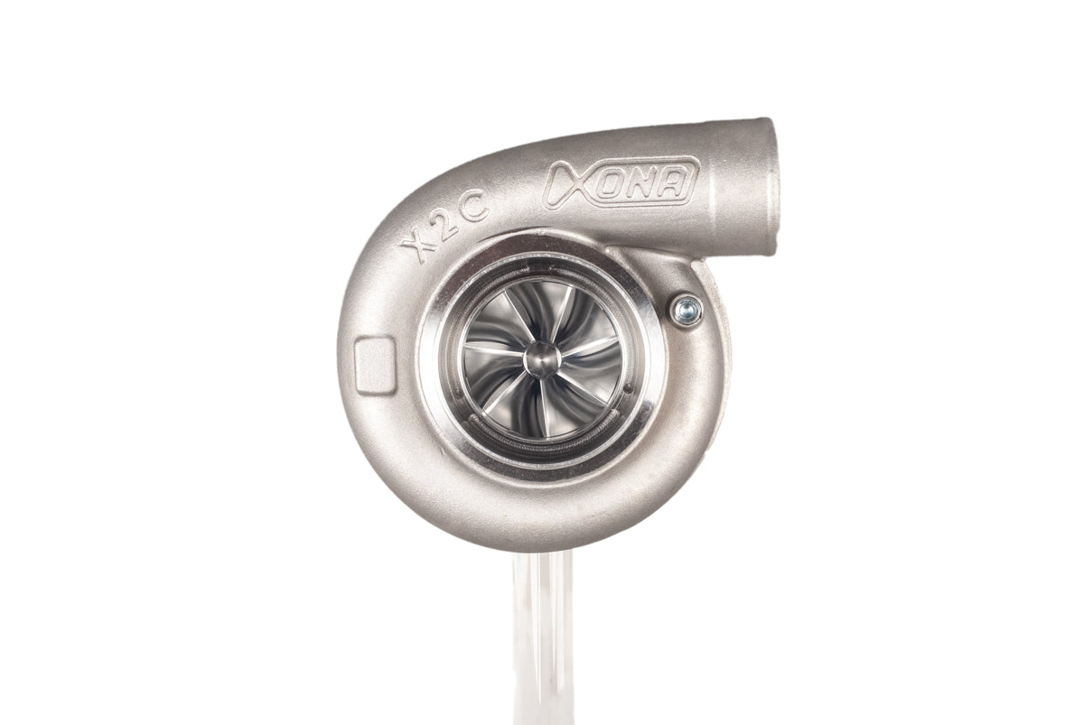 Xona XR 6557S X2C turbocharger, front angle view showing compressor wheel, housing, and outlet elbow