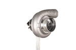 Xona XR 6557S X2C turbocharger, front angled view showing compressor housing and inlet, on stand.