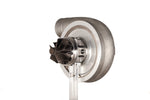 Xona XR 7864S X3C turbo compressor wheel and housing, front angle showing billet blades and shaft