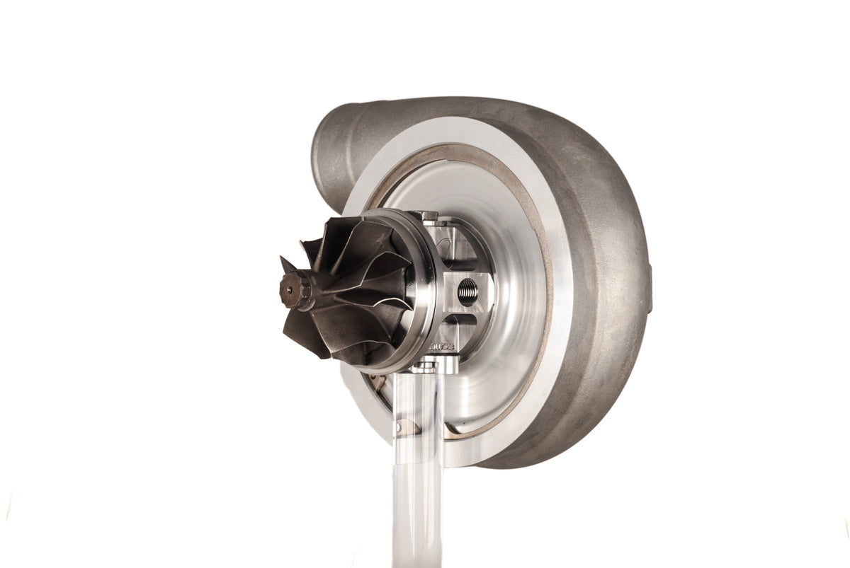 Xona XR 7864S X3C turbo compressor wheel and housing, front angle showing billet blades and shaft