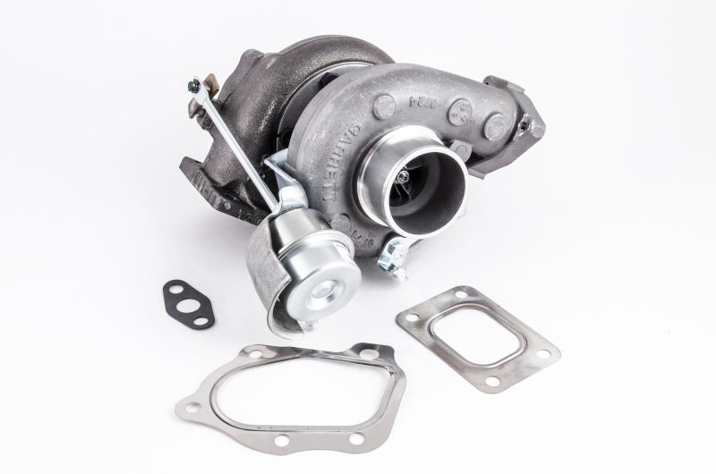 Garrett GT2554R turbocharger with wastegate actuator, shown at an angle, gaskets included below