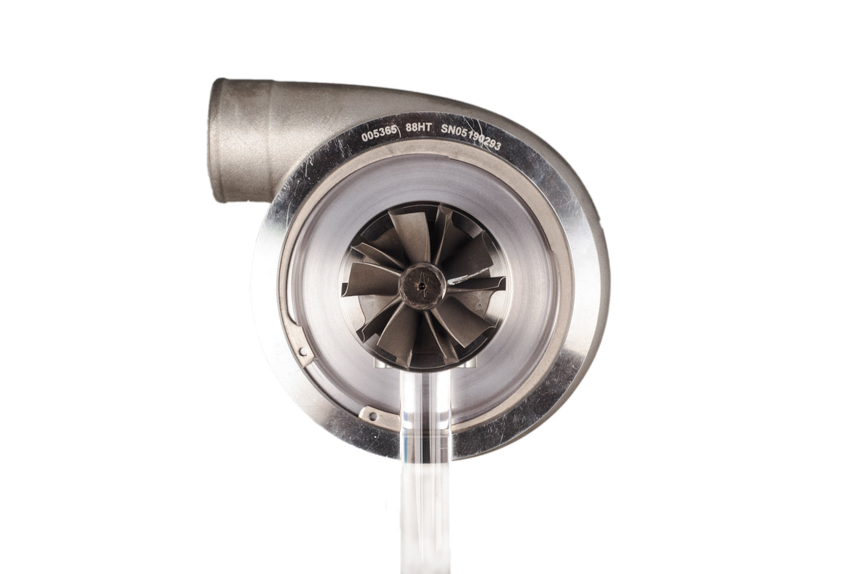 Xona XR 8269S X3C turbo, front view of compressor wheel and housing with curved inlet pipe