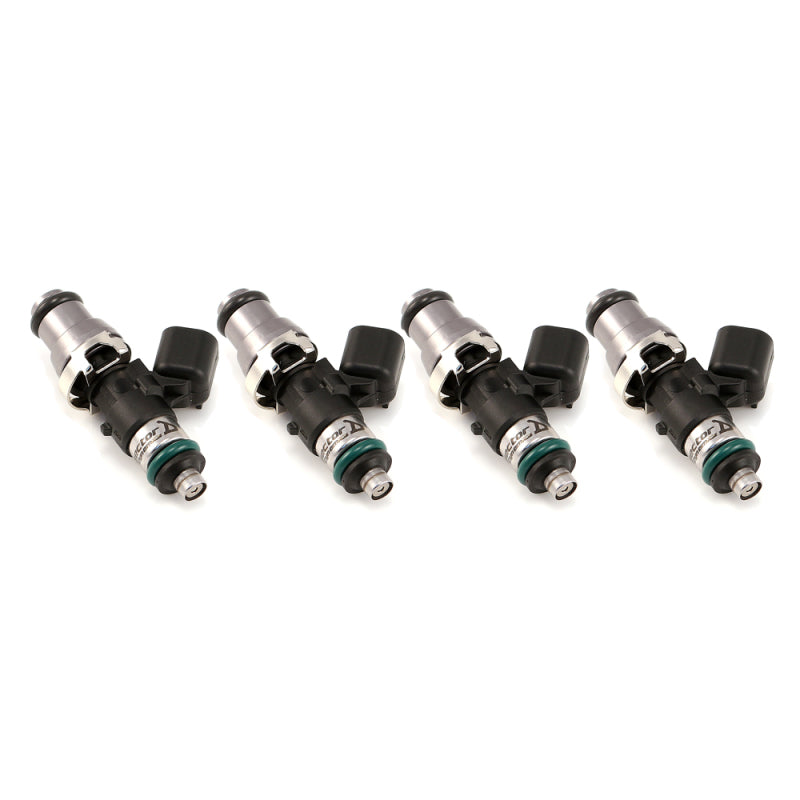 Injector Dynamics ID1050X fuel injectors, set of four, angled side view showing black connectors and green O-rings