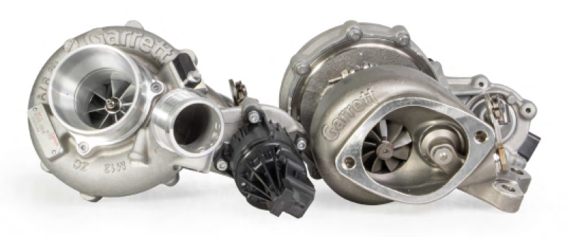 Garrett GT2260S turbo pair for F-150 3.5L, left unit showing compressor wheel, right unit with actuator visible