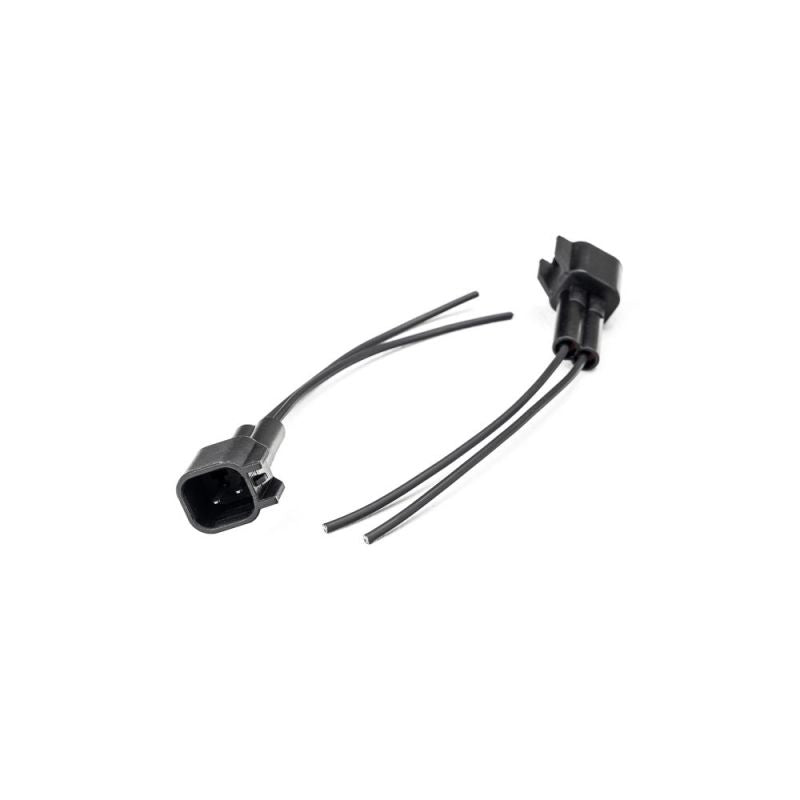 Injector Dynamics USCAR male connector pigtail kit, two wired plugs shown at angle on white background