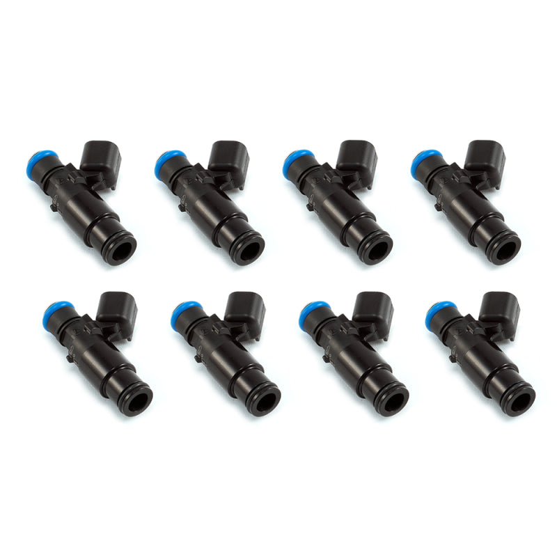 Set of eight Injector Dynamics 2600-XDS fuel injectors, side view, black bodies with blue electrical connectors on top.