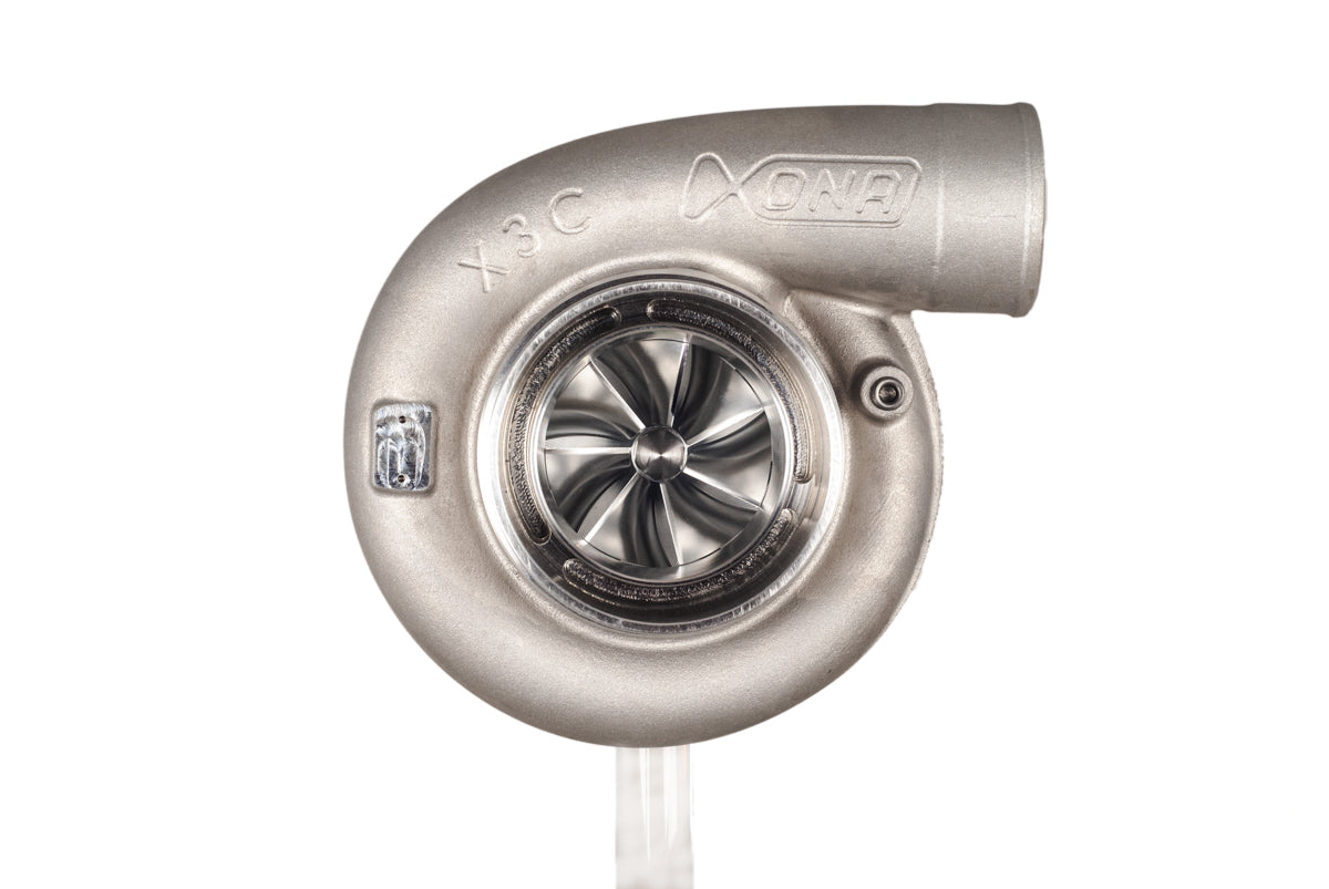 Xona XR 9569S X3C turbocharger, front view showing compressor wheel and curved outlet housing