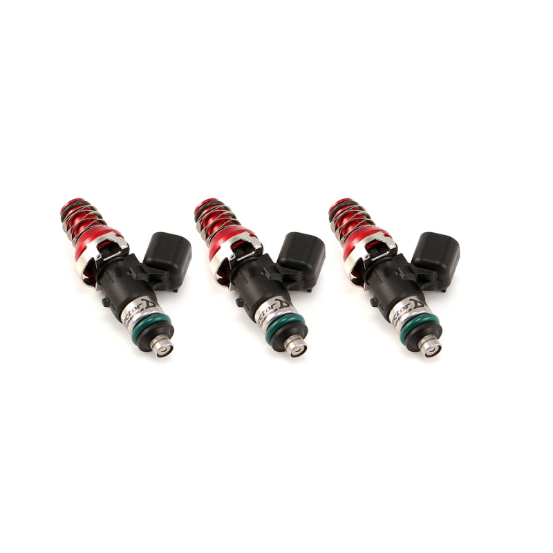 Set of three ID1050X fuel injectors, angled side view, showing red top hats, springs, and O-rings