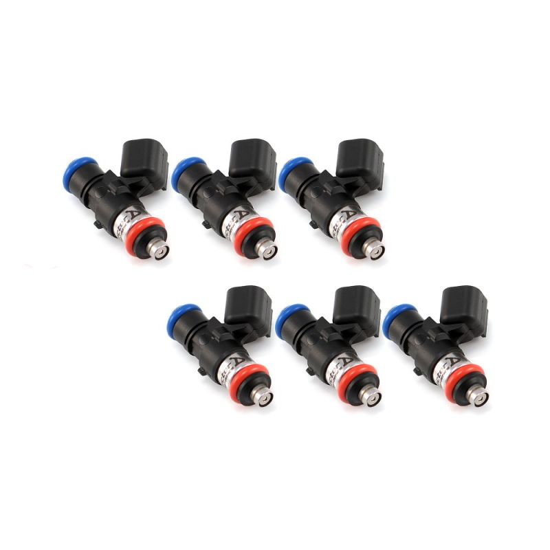 Set of six Injector Dynamics 1050cc fuel injectors, angled view showing blue top clips and red lower O-rings.