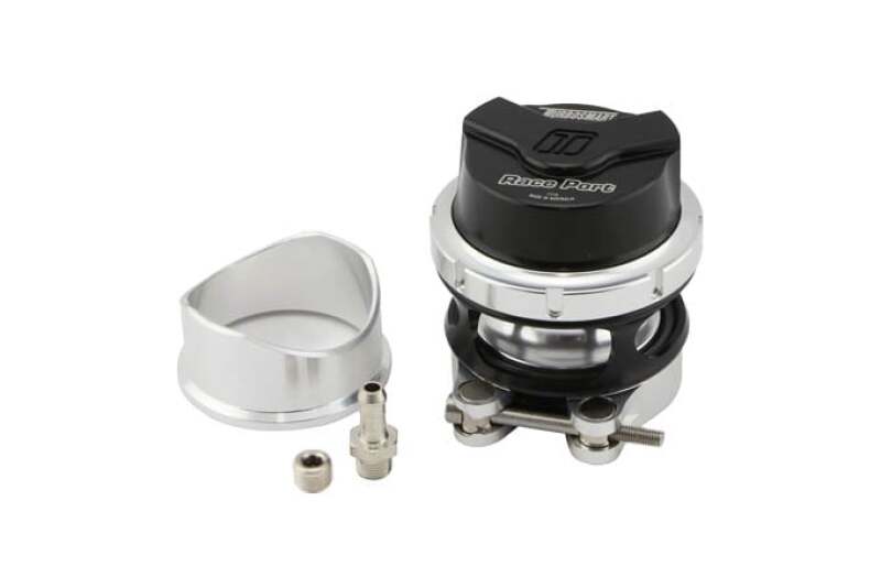 Turbosmart Race Port Gen V BOV in black, shown assembled beside its silver weld on flange and fittings.