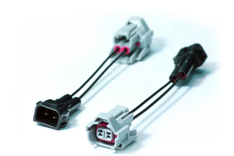 Injector Dynamics Denso OBD2 PnP Adapter, two connector pairs with black and gray plugs and wire leads