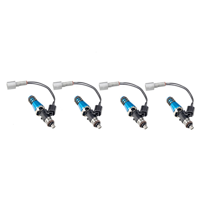 Set of four Injector Dynamics 2600-XDS fuel injectors, blue bodies with wiring adapters, front angle view