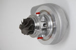 Xona Rotor 54-56 X2C turbo cartridge, front angle showing compressor wheel and red service caps