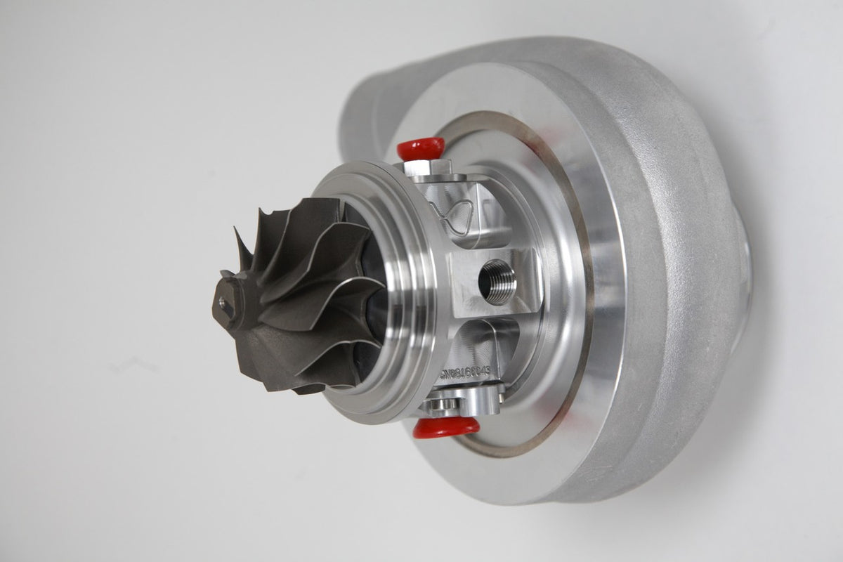 Xona Rotor 54-56 X2C turbo cartridge, front angle showing compressor wheel and red service caps