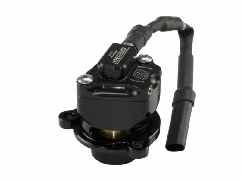 Turbosmart Kompact EM dual port VR33 BOV, angled view showing solenoid, ports, and mounting flange