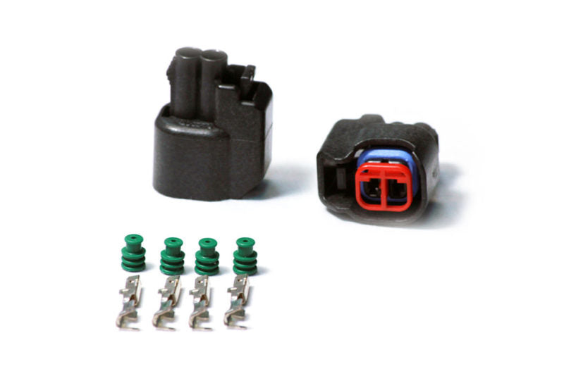 Injector Dynamics USCAR female connector kit with two black housings, four pins, four green seals