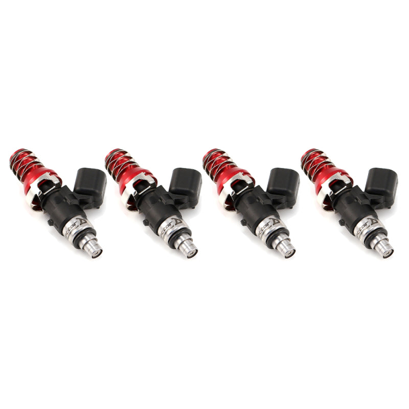 Set of four ID1050 fuel injectors, side view showing red adapter tops and black electrical connectors.