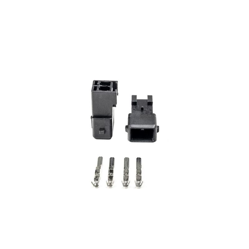 Injector Dynamics EV1 male connector kit, two black housings with four metal terminal pins shown below