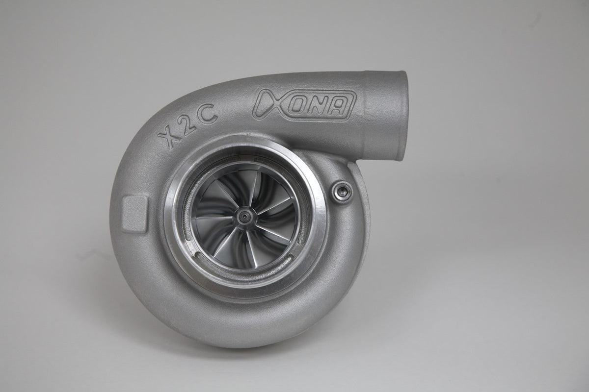 Xona Rotor 71-64 X2C turbo, front view showing compressor wheel, housing and outlet elbow