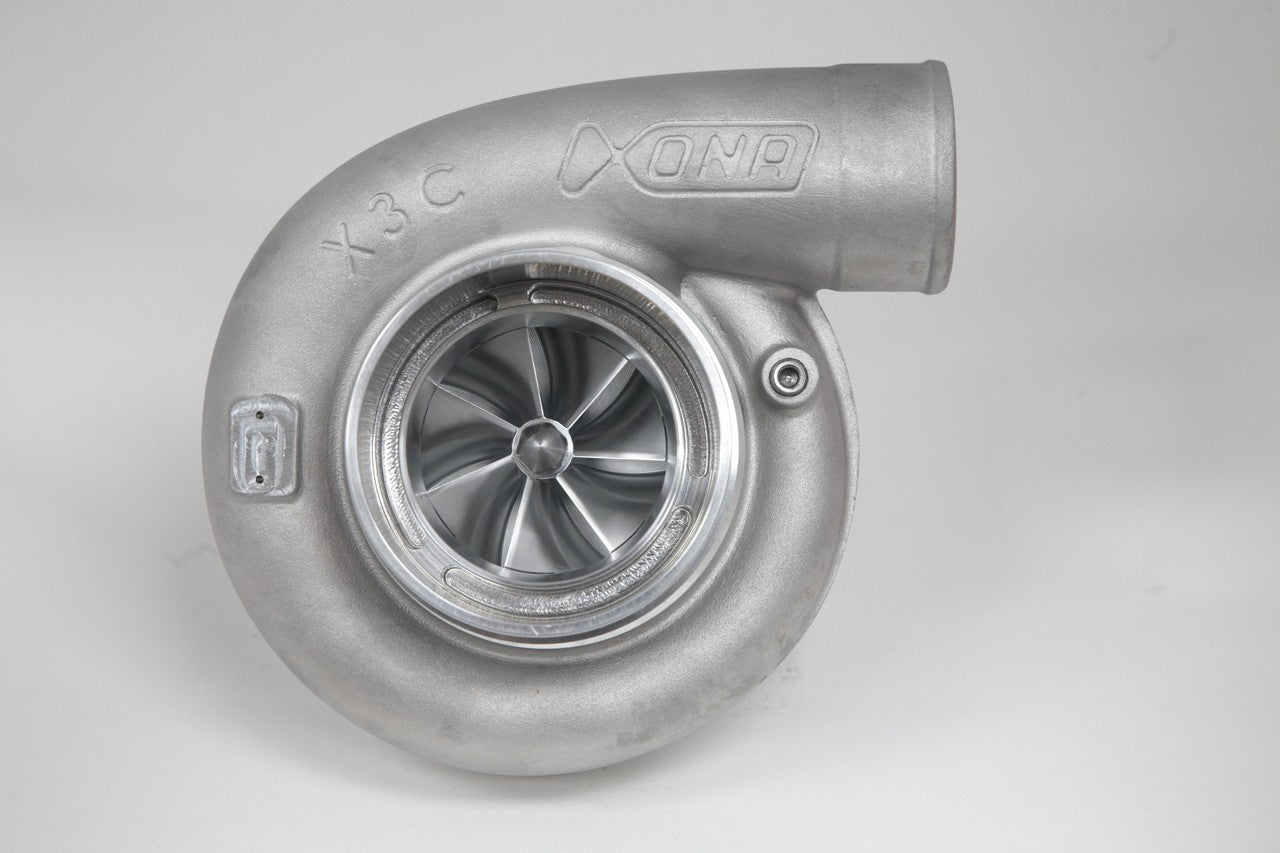 Xona Rotor 95-67 X3C turbo, front view showing compressor wheel, housing marked X3C, cast aluminum finish.