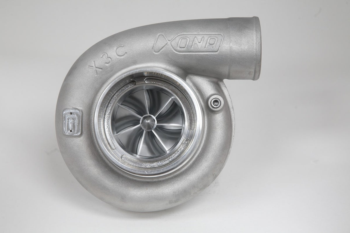 Xona Rotor 78-65 X3C turbocharger, front view showing compressor wheel, cast housing and elbow outlet