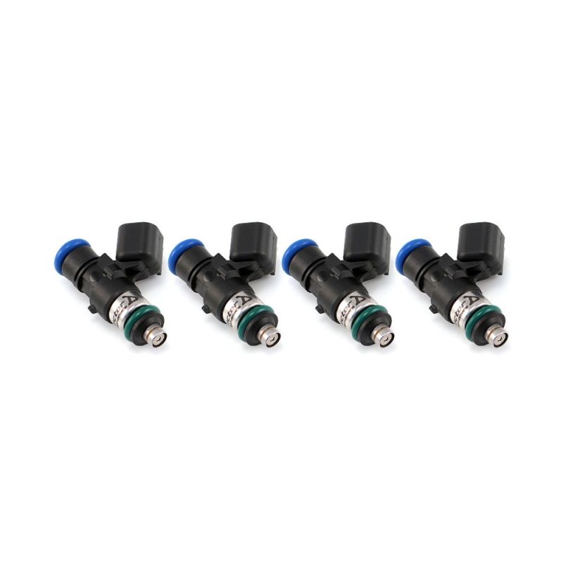 Set of four Injector Dynamics 2600-XDS fuel injectors, side view showing electrical connectors and blue top O-rings
