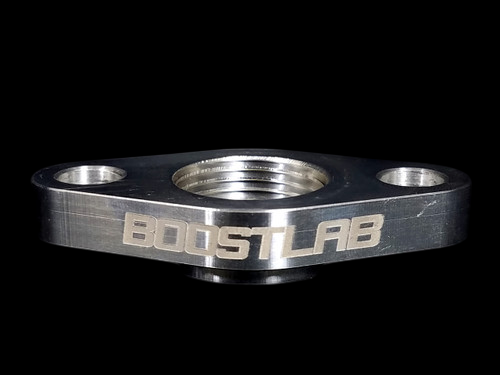 Boost Lab billet T6 large frame turbo oil drain flange, front view showing threaded 3/4 NPT center bore and two mounting holes.