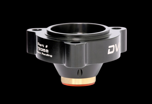 GFB DV+ diverter valve, angled view showing bolt flange, black anodized body and brass fitting