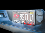 Boost Lab license plate frame installed on rear bumper, holding a Florida plate with Buccaneers design