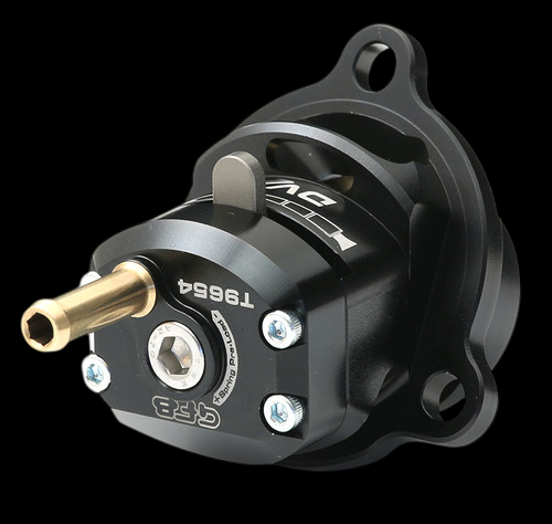 GFB DVX diverter valve, black anodized body, brass inlet, mounting flange, angled front view