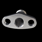 Billet oil drain flange with two bolt holes and center bore, angled top view showing raised fitting
