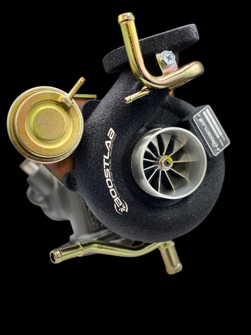 Boost Lab TD06SL2-54X turbo, top angle showing compressor wheel, wastegate actuator, and brass fittings