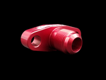 Red anodized BL Billet T3/T4 turbo oil drain flange, -10 AN fitting, angled view showing threaded port and bolt hole.