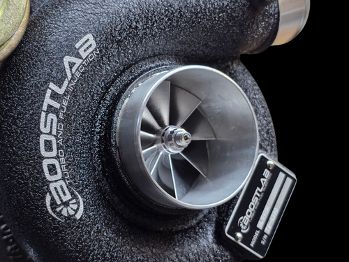 Boost Lab BL54XR turbo for Subaru STI, close up on billet compressor wheel and inlet housing.