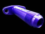 Purple billet T3/T4 extended turbo oil drain flange, angled view showing threaded -10 AN fitting and mounting hole.