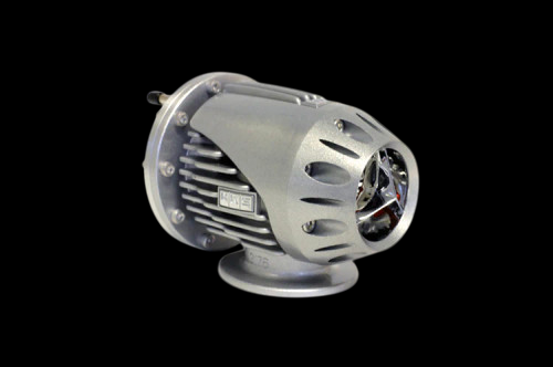 HKS Super SQV4 blow off valve assembly, angled view showing vented outlet, mounting flange, and adjuster screw.