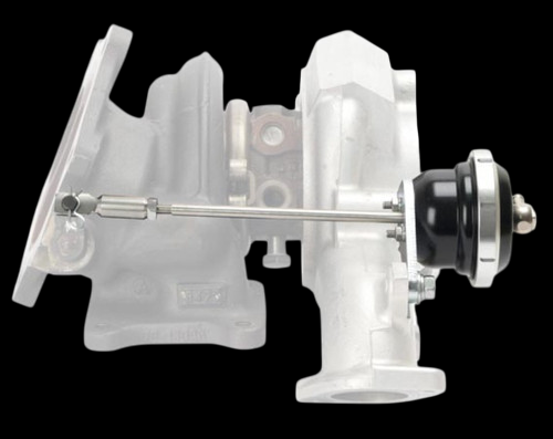 Turbosmart IWG75 black wastegate actuator mounted on EVO 10 turbo, side view with rod linkage