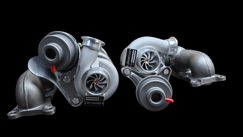 Pair of N54 BMW TD04L-17T upgrade turbos, front angle showing compressor housings and inlet pipes