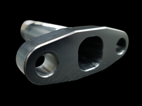 Boost Lab billet T3/T4 extended turbo oil drain flange, black anodized, angled view showing bolt holes