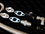 Boost Lab 2JZ single turbo oil line kit, braided hose, flanges, gaskets, fittings, and elbow adapters laid out