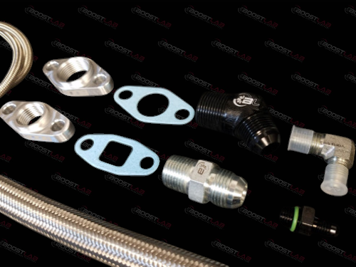 Boost Lab 2JZ single turbo oil line kit, braided hose, flanges, gaskets, fittings, and elbow adapters laid out