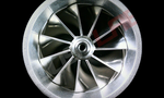 Boost Lab BL372R turbo compressor wheel, front view showing curved blades and center hub