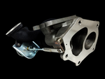 EVO-X TD06SL2-20G billet turbocharger, angled view of turbine housing with wastegate actuator and linkage attached.